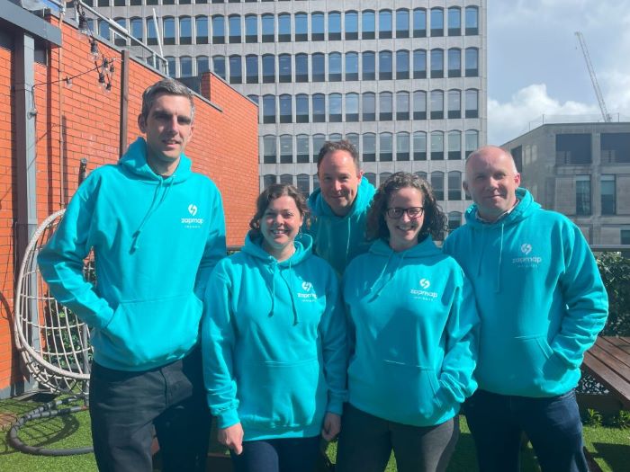 Insights team in teal hoodies
