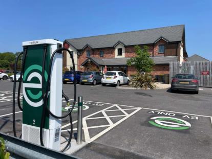evyve charger in a car park in front of pub