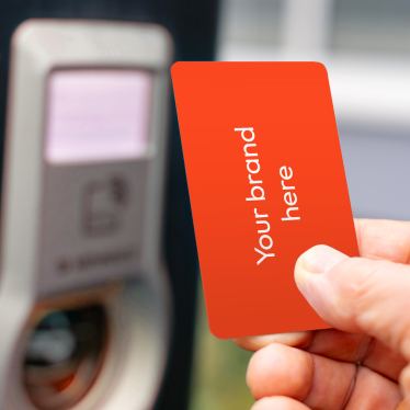 An image of an unbranded RFID card infront of an EV charger