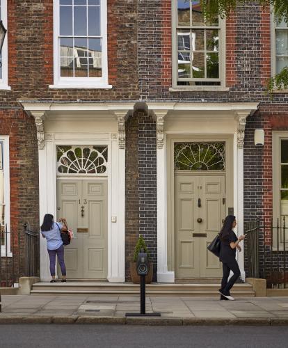 Connected kerb bollard charge point on residential street