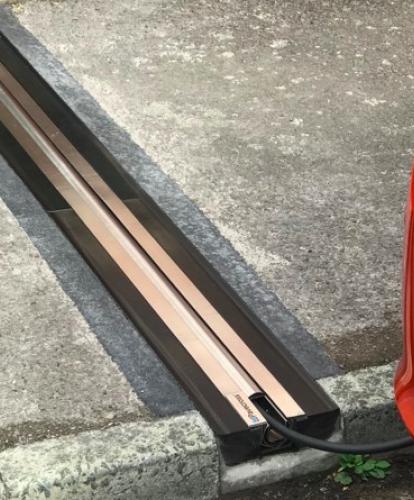 Cross pavement charging solution - gully