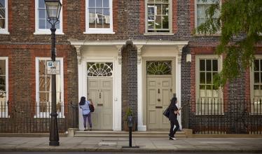 Connected kerb bollard charge point on residential street