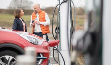 Stock photo-  Evyve charge point - couple charging